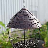 Round shape. Black mesh tray. roof connected by poles to protect the seeds.