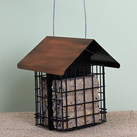 Two cages, one on each side filled with a suet cake. Copper coloured triangular roof over the top.