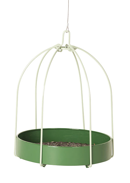 Green circular tray with seeds inside. Has 6 white poles that meet in the center to hook onto the hanger.