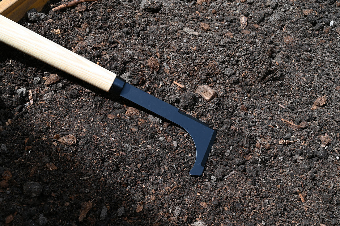 Weeder is laying in the soil.