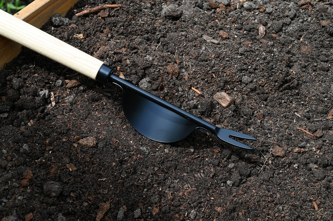 Weeder is laying in the soil.