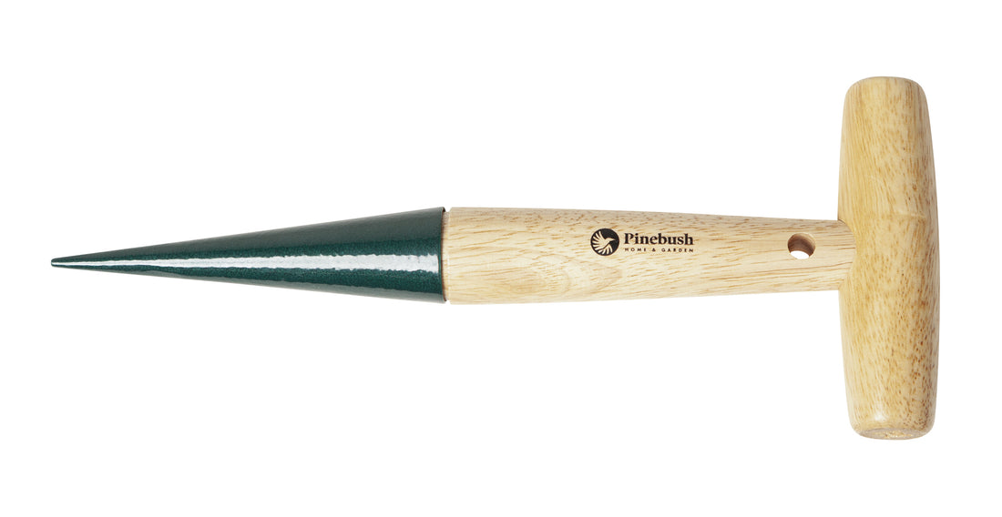 In the shape of the letter "T". The handle is beige and wooden, and the bottom is pointed and green.