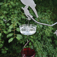 Ant moat has a bird feeder attached to the bottom hook.