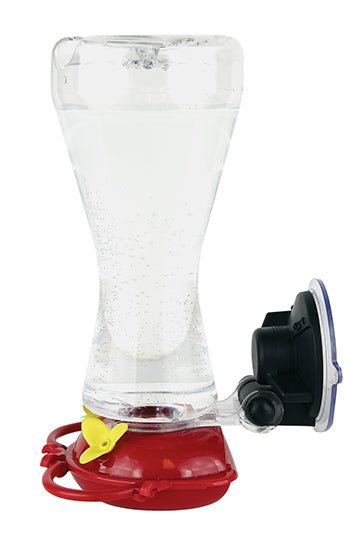 Clear feeder with red circular base and yellow flower shaped feeding holes.