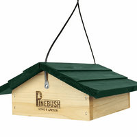 Green roof with a square wooden base that has a cage underneath to put the suet cakes.