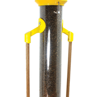 Cylinder tube shape, metal hanger, bright yellow top and base, clear tube to see feed inside, two wooden dowel perches that are parallel to the tube.