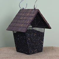 House shaped feeder. Mesh bottom filled with seeds. Shingle styled roof.