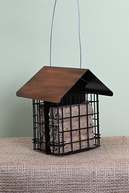 Two cages, one on each side filled with a suet cake. Copper coloured triangular roof over the top.