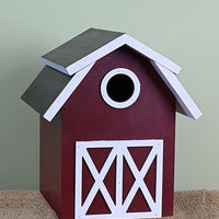 Wood construction. Barn shape. Entrance hole in the centre top portion of the house. 2 white decorative doors on the front.