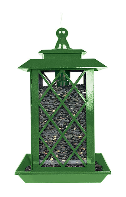 Green lantern shaped feeder filled with sunflower seeds.