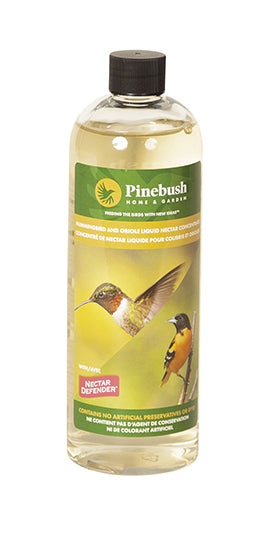 Nectar is in a clear bottle. Black lid, label has the Pinebush logo on it, and a photo of a hummingbird and oriole.