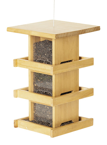 Condo style wood feeder. Has 3 levels of trays and windows. Filled with seeds at each window.