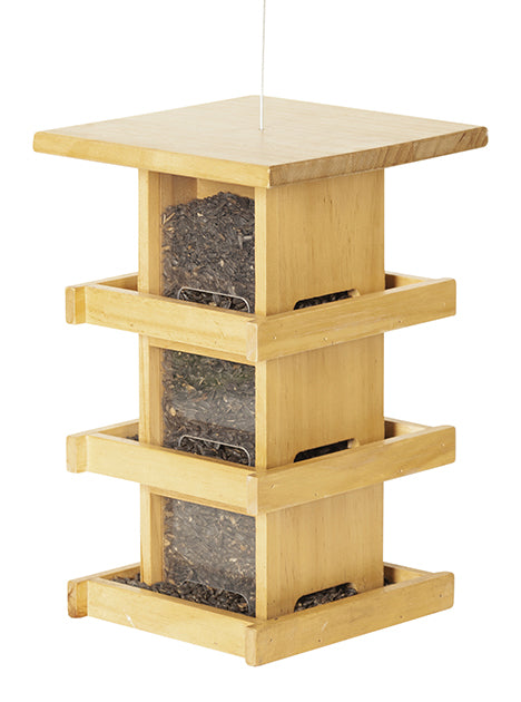 Condo style wood feeder. Has 3 levels of trays and windows. Filled with seeds at each window.