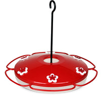 Red tray with white flower shaped feeding holes. Black hook in the center to assist with hanging.