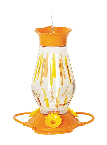 Orange circular lid and base, base has yellow flower feeding holes. Glass is pear shaped with yellow and orange stripes.