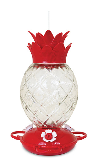 Pineapple shaped feeder. Red lid and base. Base has white flower shaped feeding holes.