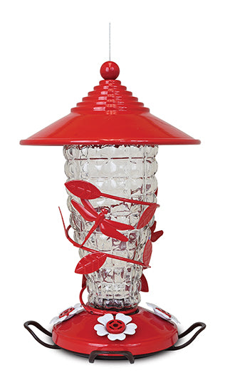 Red cones shaped lid, red base with white flower shaped feeding holes. Glass has a bubble-like texture, and also has red leaves and dragonflies wrapped around it.