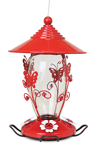 Red lid and base. Bas has white flower shaped feeding holes. Butterfly metal designs on the glass.