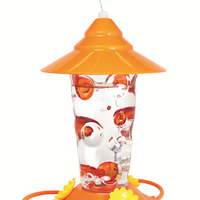 Cone shaped orange lid, clear glass for nectar with orange hand painted dots on it, orange circular base with yellow flower shaped feeding holes.