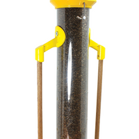 Cylinder tube shape, metal hanger, bright yellow top and base, clear tube to see feed inside, two wooden dowel perches that are parallel to the tube. 