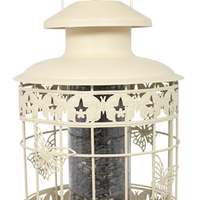 Cream coloured feeder with beautiful butterfly deccrations along the cage that protects the seeds from squirrels.